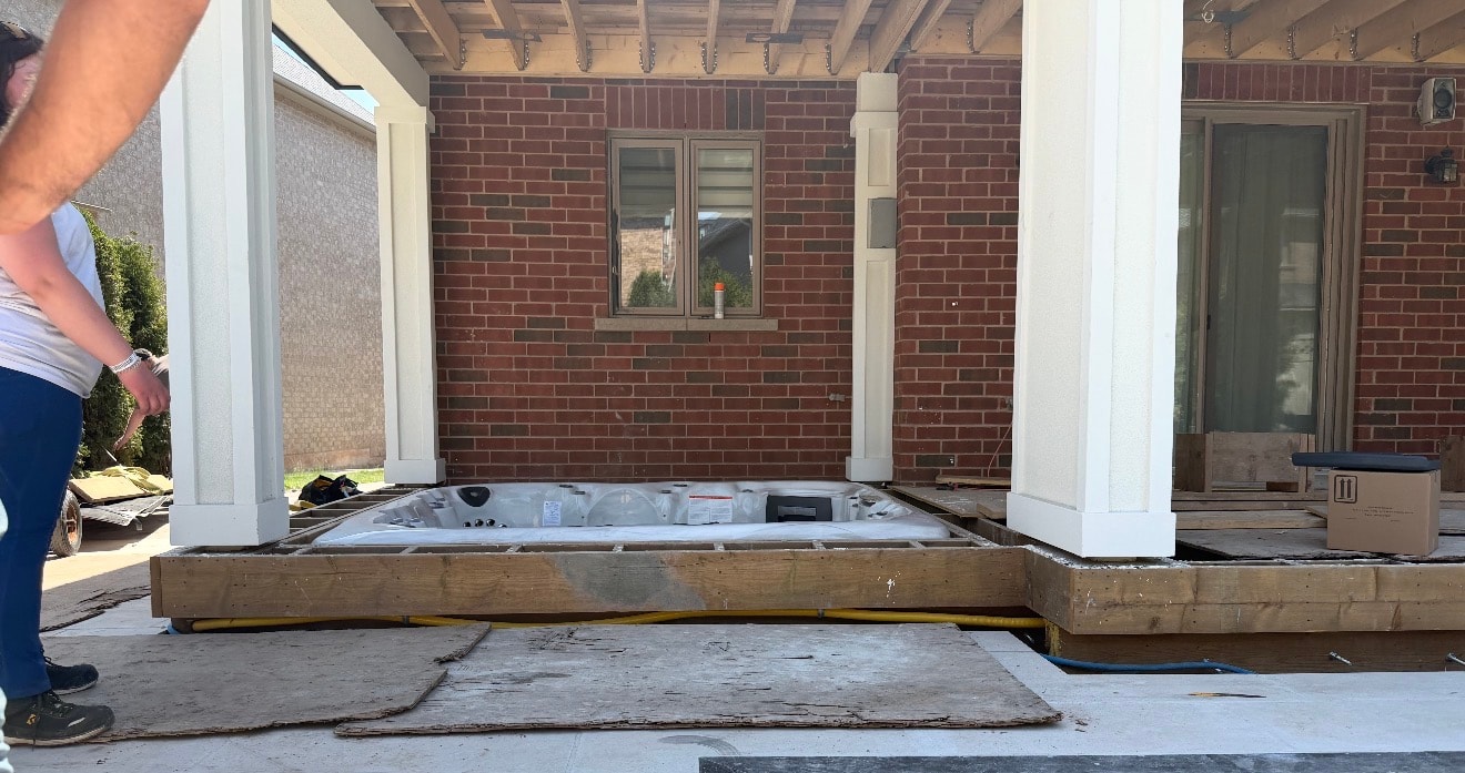 Hot tub installed under covered porch