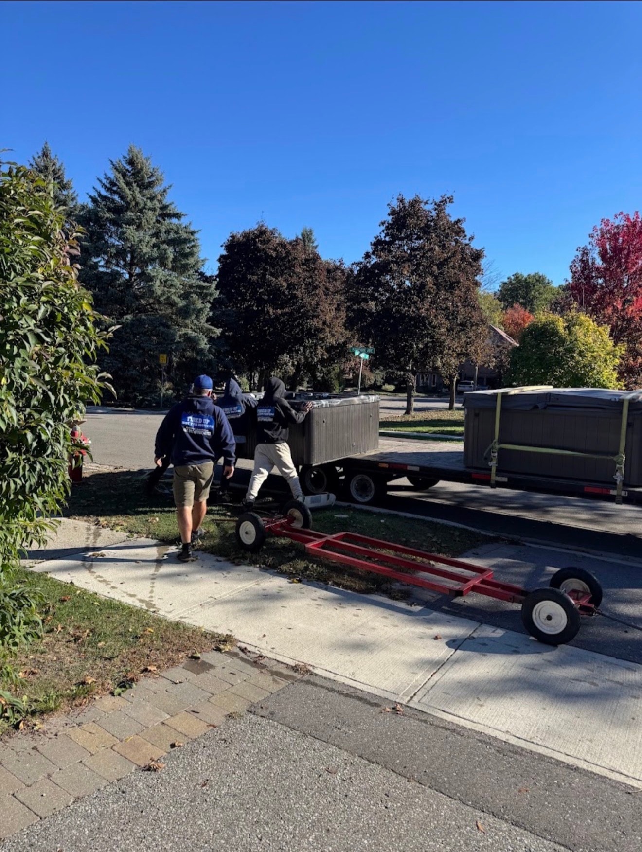 Fired Up crew loading hot tub onto trailer